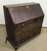 A 19th Century Provincial oak bureau, th