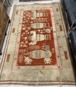 A vintage Khotan carpet, the central pan