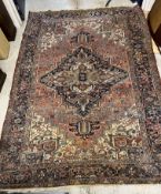 An old Heriz carpet, the central panel s