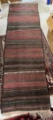 A Kelim runner, the striped design in re