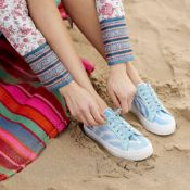 A pair of World Secrets sneakers - Our 'She Who Dares' sneakers are handmade with Ikat silk and