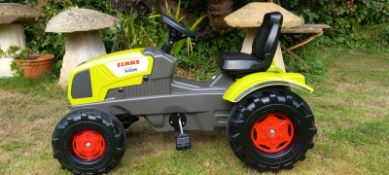 A Claas Pedal Tractor 3-8 years - A Claas 340 AXOS Pedal Tractor. Age recommendation 3-8 years.
