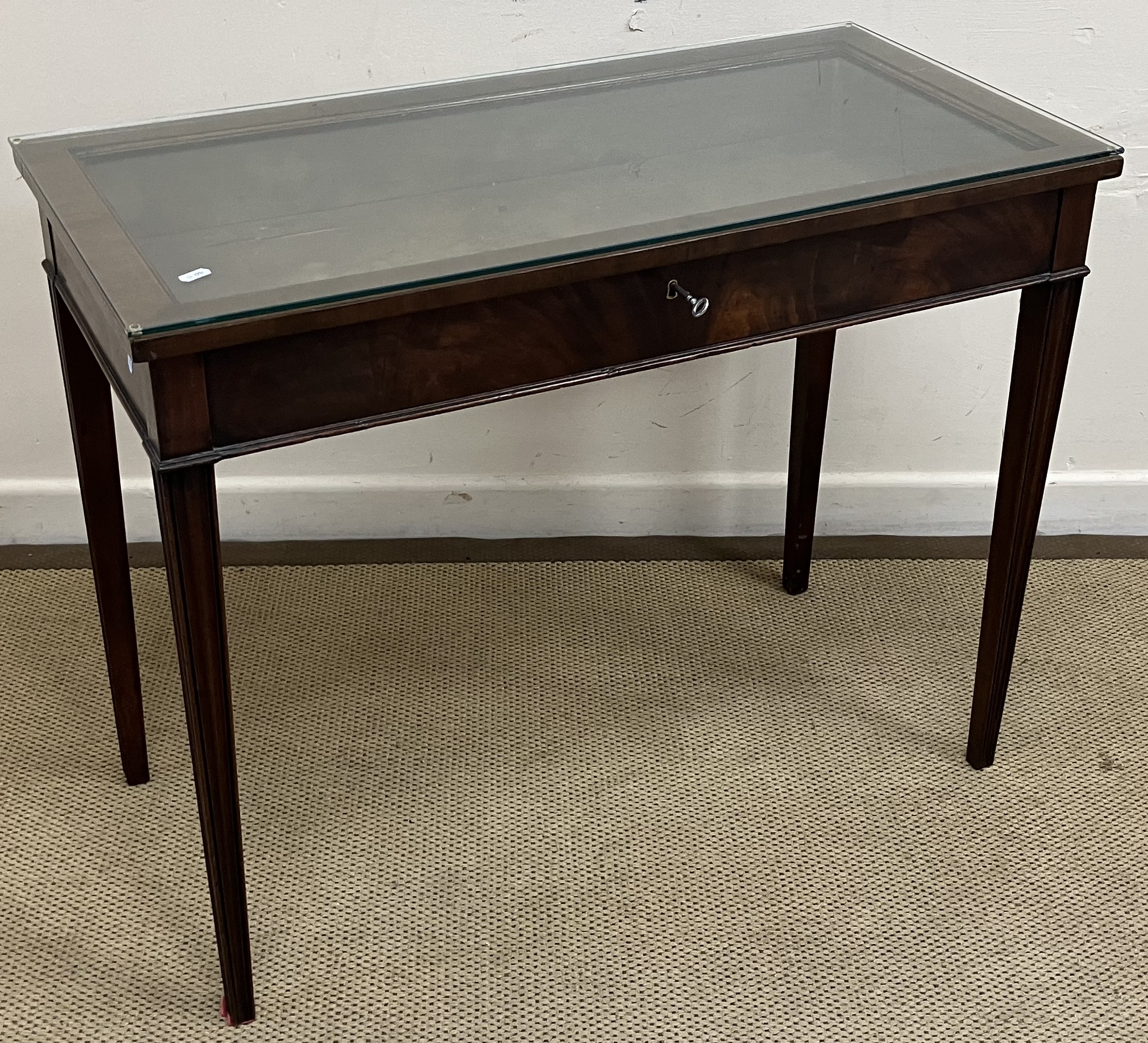 An Edwardian mahogany bijouterie table in the George III taste,