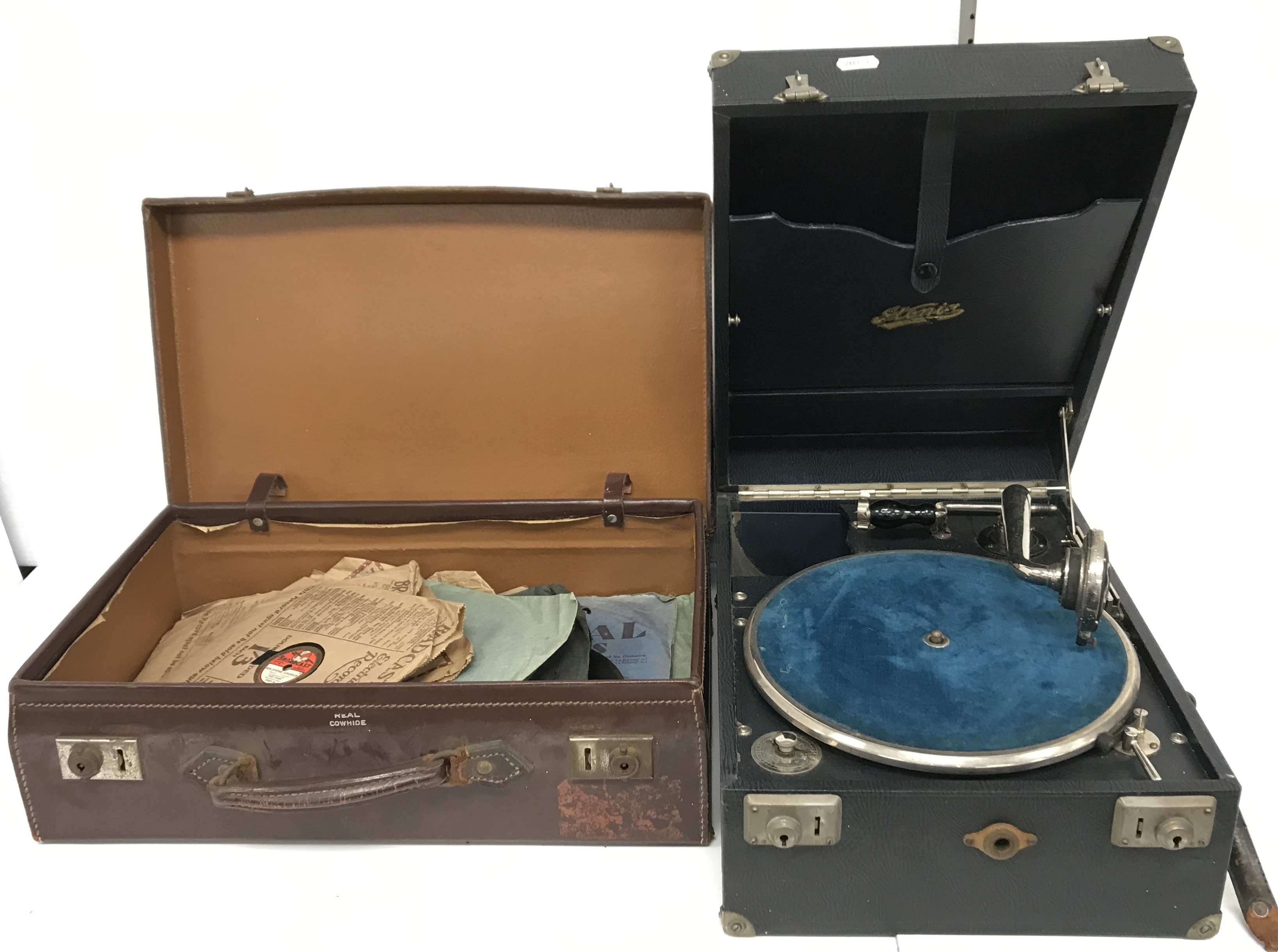 A Stonia portable gramophone and suitcase containing a small quantity of 78 rpm records