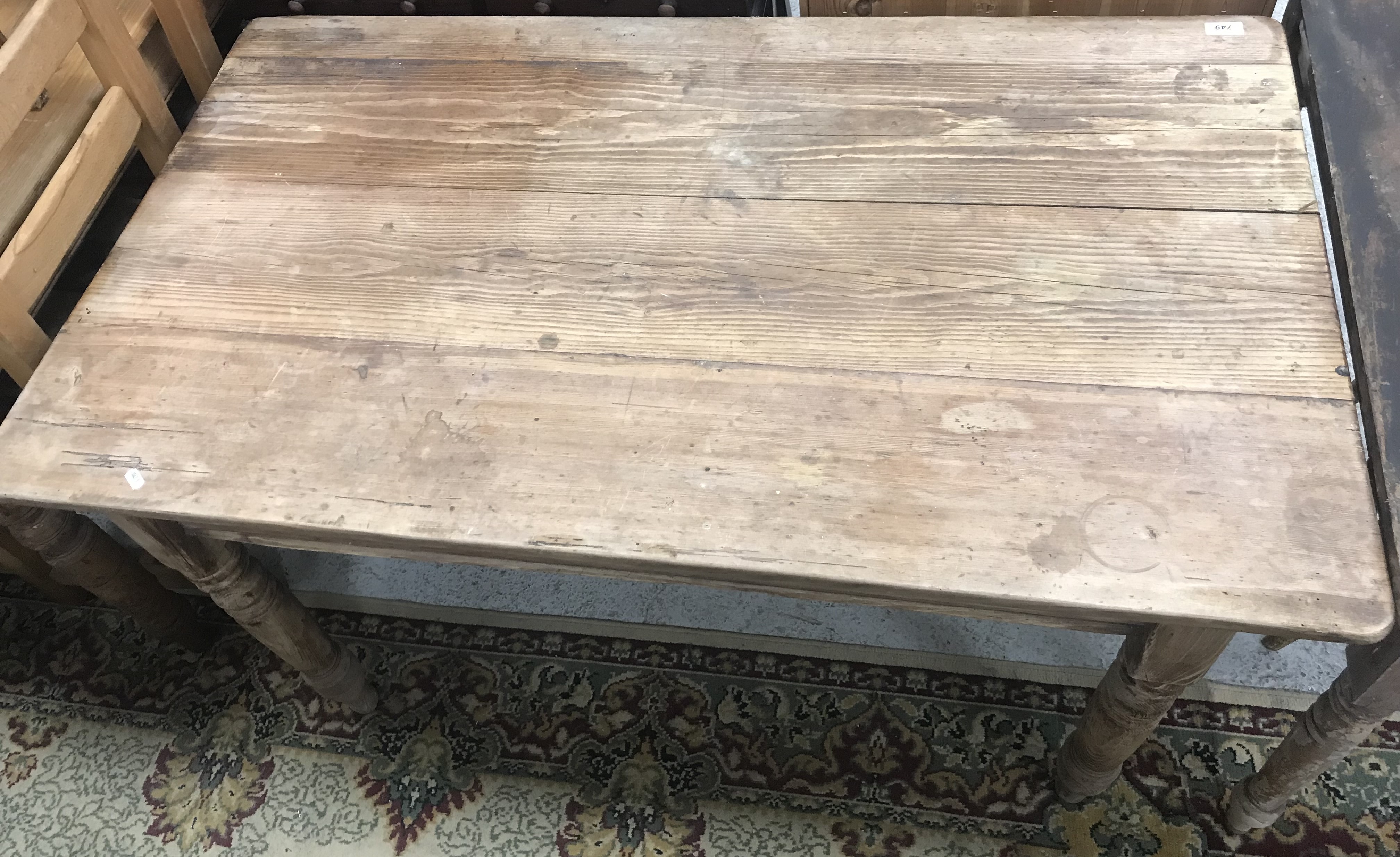 A pine farmhouse style kitchen table,