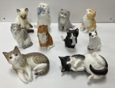 A collection of Royal Worcester Cat figu