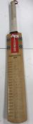 A Gray-Nicolls cricket bat, signed by th