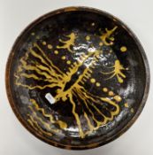 A treacle glazed slip ware dish attribut
