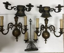 A pair of brass twin light wall sconces