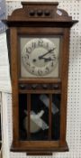 A late Victorian oak cased mantel clock,