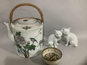 Two Blanc de Chine porcelain figures of cats together with a Chinese teapot having a cylindrical