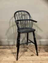 A 19th century ebonised child's Windsor high chair, 86cm high