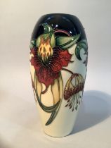 A Moorcroft pottery vase of Anna Lily design, ovoid, impressed mark and painted 98 to underside, 8.