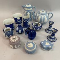 A collection of Wedgwood Jasperware including a lilac dish and cover, a dark blue bottle neck