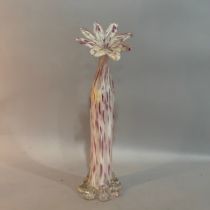 A tall art glass vase of fluted wrythen form, clear glass with mottled white and purple inclusions