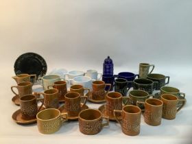 A quantity of Portmerion 'Totem' ware designed by Susan Williams-Ellis in honey, green and blue