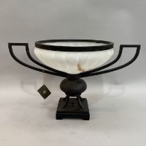 A bronze effect and opaque glass two-handled urn on square plinth and bracket feet, 66cm wide x 39cm