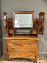A Victorian satinwalnut triple mirrored dressing table having pierced sides with three drawers on