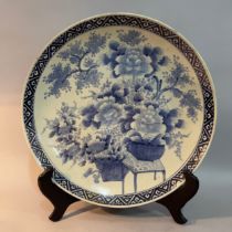 Large Chinese blue and white charger, painted with urns and baskets of peony (cracked), 45cm