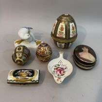 A porcelain oval hinged trinket box with metal clasp painted with a portrait of a woman, a Limoges