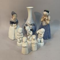 A Royal Copenhagen figure of a Amager girl 1251, Girl from Bornholm 1323 A/F, three white B&G