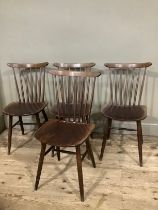 A set of four spindle back Drevounia chairs, some with labels to base