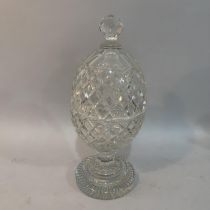 A late 19th/early 20th century cut glass pedestal vase and cover with faceted knop finial and on