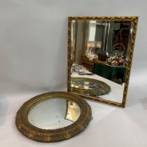 Convex wall mirror in gilt plaster leaf-moulded frame 55cm diameter together with a gilt rectangular