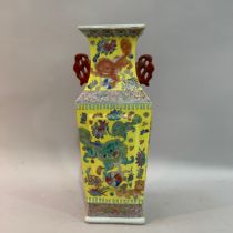 A Chinese square vase enamelled with Chinese guardian lions with pearls and chrysanthemums, bordered