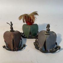 Three leather falconry hoods, one with feather plume, 20th century (3)