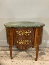 A continental walnut starburst inlaid oval chest with two drawers above cut out apron and with