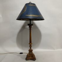 A faux walnut and faux bronze table lamp, the reeded column having a foliate rimmed sconce, lobed