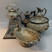 A silver plated etched and fluted lidded ewer, a heavily moulded spirit kettle and stand, a