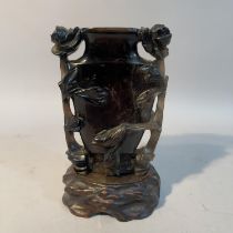 A Chinese dark grey quartz vase carved in relief with flowering branches and bird, 13.5cm high
