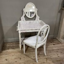 A cream and mosaic tiled dressing table with oval mirror and shaped under tier 84cm wide, together