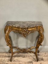 A composite gilt console table on four cabriole legs with cross stretcher, the apron moulded with