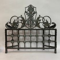 A steel three-fold fire guard, scrolled cresting centred with a basket of flowers and leaf curls,