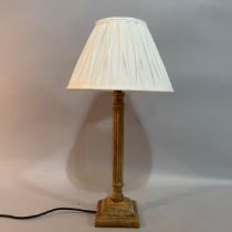 A hardwood reeded column table lamp on stepped square base with beading, white shade, 57cm high