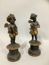 A pair of spelter and gilt cherubs, after Moreau, each raised on a plinth, 24cm