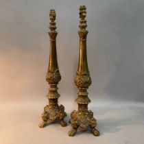 A pair of gilt metal baluster table lamps with acanthus collar, foliate base on four paw feet, 57m