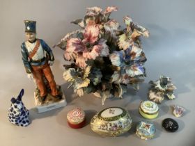 A porcelain flower cluster in a basket, a continental figure of a Hussar bearing blue mark to
