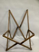 A folding deck chair frame with no fabric