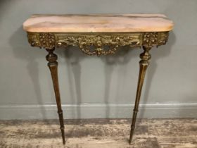 A gilt metal ornate console table with heavily carved and moulded front, with marble top, 72cm wide