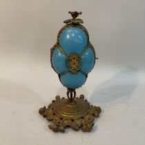 A Victorian gilt metal mounted turquoise glass pedestal casket of quatrefoil outline, flower finial,