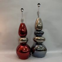 Two pebble tower floor lamps in silver and pewter and in ruby and silver (one pebble cracked) chrome