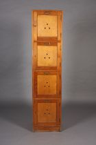 A set of four vertical pine and plywood lockers mid 20th century each with brass window plate, on