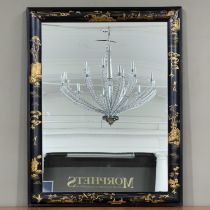 A black lacquered and gilt chinoiserie wall mirror, rectangular, 64cm x 83cm