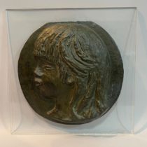 After Pierre-Auguste Renoir, a cast bronze medallion of the profile of Coco the youngest son of