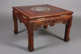 A Chinese hardwood table of square outline, inlaid in mother-of-pearl with dragons and archaic