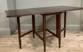 A 1970's mahogany drop leaf dining table on rounded legs